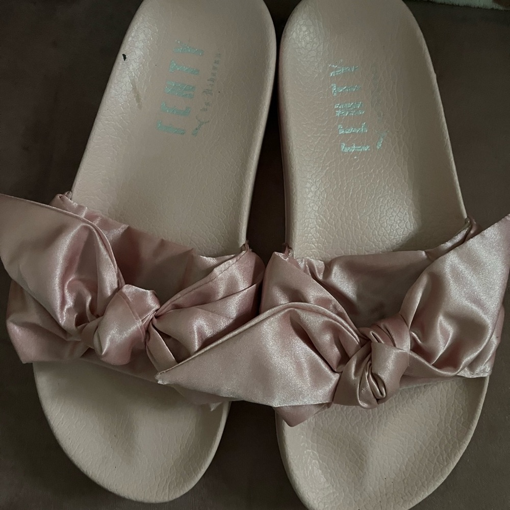Pink slides. Bottom says size 7 but they fit my size 9 feet. Super comfortable